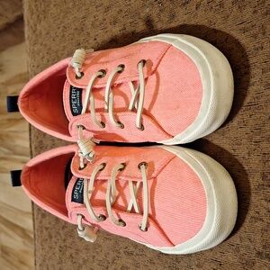 Pink and white Sperry slip-on shoes
